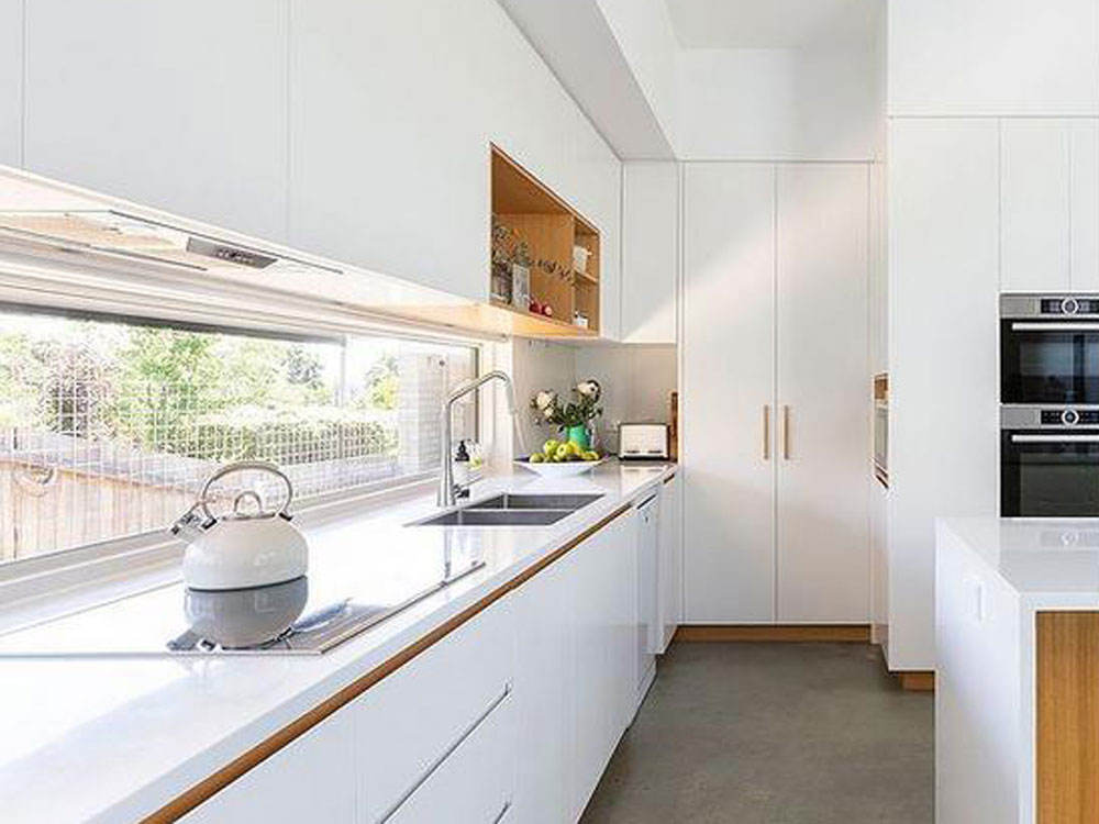 Charred Timber House kitchen featuring a Schweigen silent rangehood 