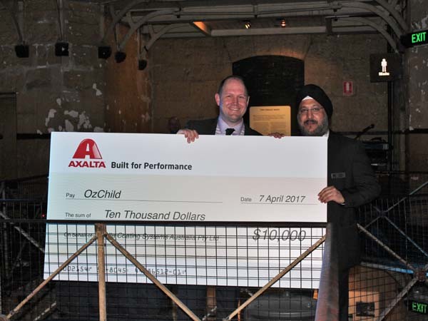 Sobers Sethi, Vice President, Axalta Coating Systems and President, Emerging Markets presenting donation to OzChild Executive, Mark Powell
